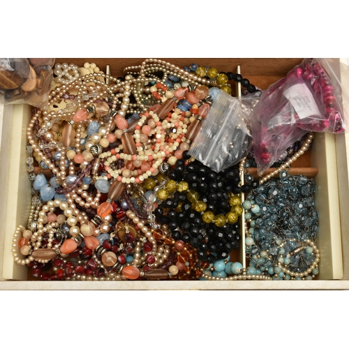 204 - A SELECTION OF JEWELLERY AND BEADS, to include a large selection of bead necklaces, some comprising ... 