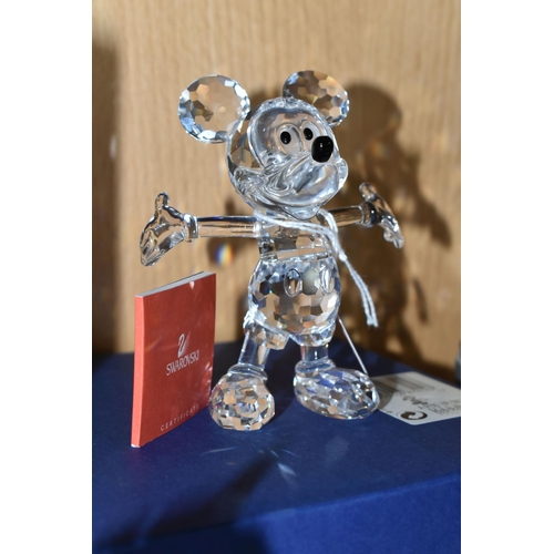 405 - A BOXED SWAROVSKI CRYSTAL DISNEY SHOWCASE COLLECTION 'MICKEY MOUSE' FIGURE, modelled standing with o... 