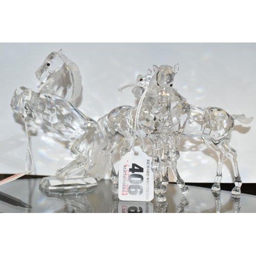 406 - TWO BOXED SWAROVSKI CRYSTAL SCULPTURES OF HORSES, comprising a Foals Clear figure group no 627637, f... 