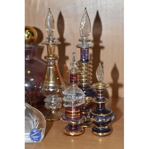 412 - A COLLECTION OF GLASS SCULPTURES AND SCENT BOTTLES, comprising three Mats Jonasson relief glass scul... 