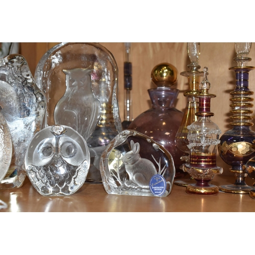 412 - A COLLECTION OF GLASS SCULPTURES AND SCENT BOTTLES, comprising three Mats Jonasson relief glass scul... 