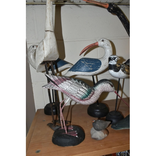 414 - A COLLECTION OF WOODEN AND CERAMIC SHORE BIRDS, including a Helmsdale Pottery Lapwing, a mid-twentie... 