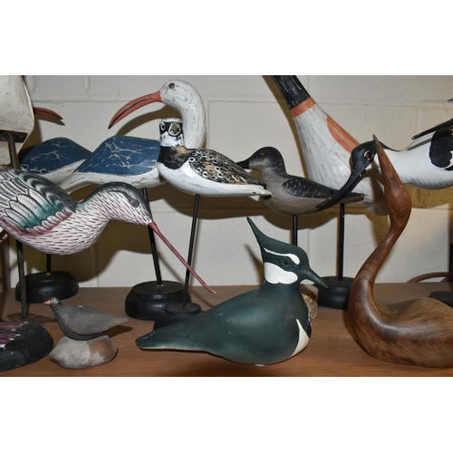 414 - A COLLECTION OF WOODEN AND CERAMIC SHORE BIRDS, including a Helmsdale Pottery Lapwing, a mid-twentie... 