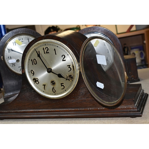 432 - THREE OAK CASED MANTEL CLOCKS, eight day striking, one clock has maker's mark Smiths Enfield, two ke... 