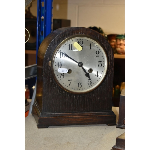 432 - THREE OAK CASED MANTEL CLOCKS, eight day striking, one clock has maker's mark Smiths Enfield, two ke... 