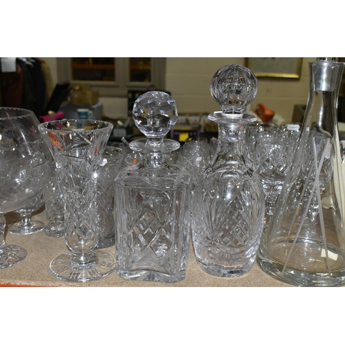 434 - A QUANTITY OF GLASSWARE, comprising three decanters, a set of six cut glass wine glasses, a small de... 