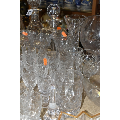 434 - A QUANTITY OF GLASSWARE, comprising three decanters, a set of six cut glass wine glasses, a small de... 