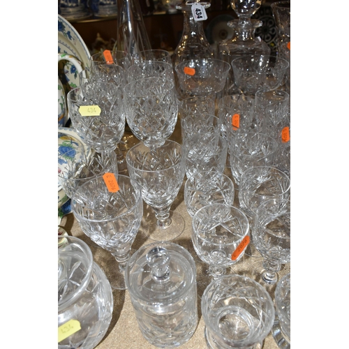 434 - A QUANTITY OF GLASSWARE, comprising three decanters, a set of six cut glass wine glasses, a small de... 