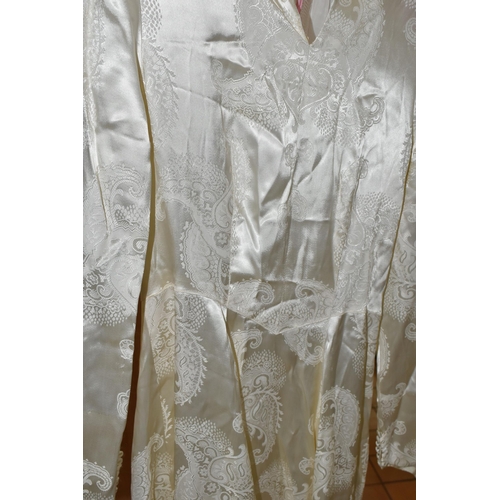 469 - A VINTAGE WEDDING DRESS,  bespoke dress with a court train, paisley design cream satin, long sleeved... 