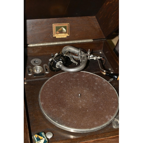 471 - AN EARLY 20TH CENTURY OAK CASED HMV MODEL 109 TABLE TOP GRAMOPHONE, with winding handle, an HMV need... 