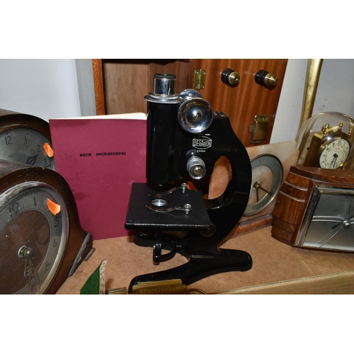 478 - A CASED BECK MICROSCOPE, FOUR VARIOUS MANTEL CLOCKS AND A BOX OF BRASSWARE, CAR BADGES, DRESSING TAB... 