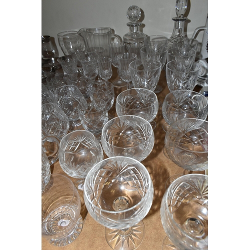 505 - A LARGE QUANTITY OF CUT CRYSTAL AND GLASSWARE, comprising a Royal Doulton decanter (chipped stopper)... 