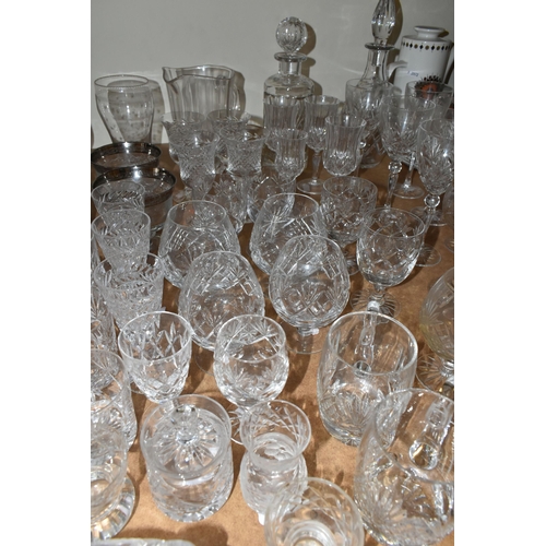 505 - A LARGE QUANTITY OF CUT CRYSTAL AND GLASSWARE, comprising a Royal Doulton decanter (chipped stopper)... 