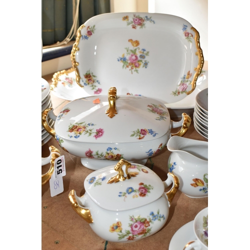 510 - LIMOGES DINNER SET, transfer print floral design on a white ground, gold gilt handles, comprising tw... 