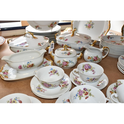 510 - LIMOGES DINNER SET, transfer print floral design on a white ground, gold gilt handles, comprising tw... 