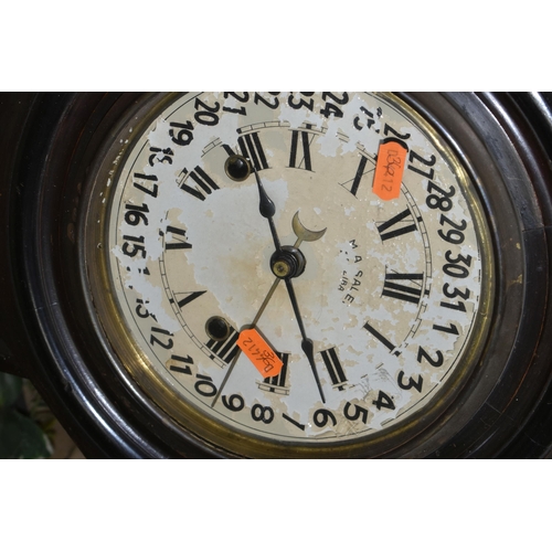 545 - AN EARLY 20TH CENTURY WALNUT STAINED REGULATOR WALL CLOCK, the circular painted 18cm dial with Roman... 