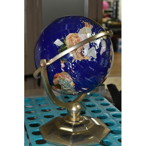 560 - A MODERN TABLE TOP TERRESTRIAL GLOBE, mounted in a brass gimbal stand / frame, height 36cm