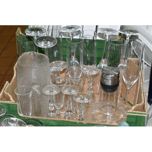 579 - TWO TRAYS OF GLASSWARE, to include four vintage medicine bottles, eleven champagne flutes, decanter,... 