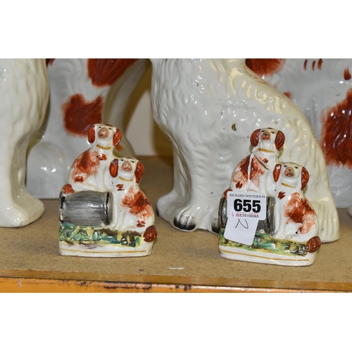 655 - SEVEN STAFFORDSHIRE/STYLE SPANIEL FIGURES, comprising a pair of small spaniel figure groups, each de... 