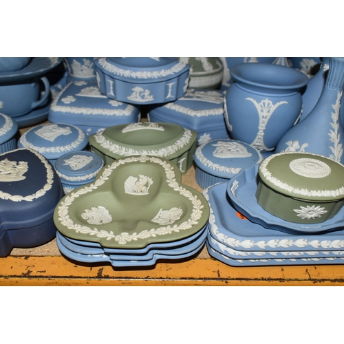 679 - A QUANTITY OF WEDGWOOD JASPERWARES, over sixty pieces to include jugs, vases, a covered vase height ... 