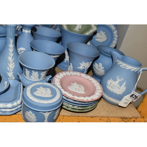 679 - A QUANTITY OF WEDGWOOD JASPERWARES, over sixty pieces to include jugs, vases, a covered vase height ... 