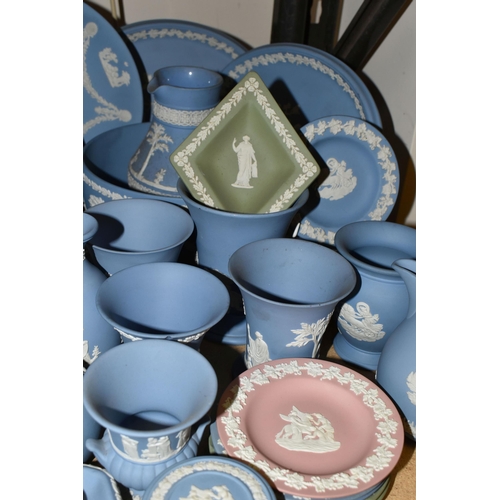 679 - A QUANTITY OF WEDGWOOD JASPERWARES, over sixty pieces to include jugs, vases, a covered vase height ... 