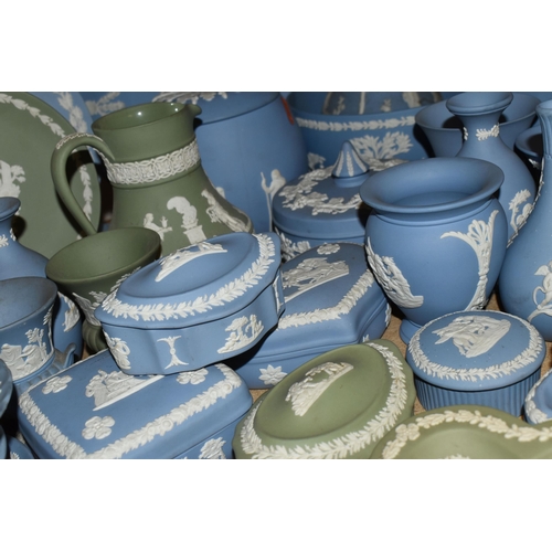 679 - A QUANTITY OF WEDGWOOD JASPERWARES, over sixty pieces to include jugs, vases, a covered vase height ... 