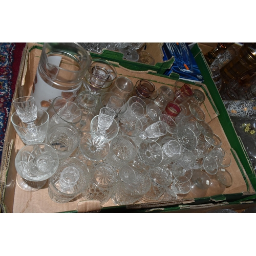 724 - SEVEN BOXES OF GLASSWARE,  a large quantity of mid-century glassware, to include decanters, floral t... 