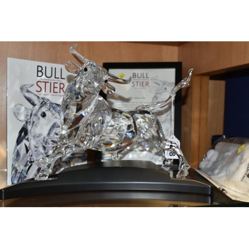 398 - A CASED SWAROVSKI CRYSTAL LIMITED EDITION CLEAR BULL SCULPTURE, numbered 5906/10000 to underside, th... 