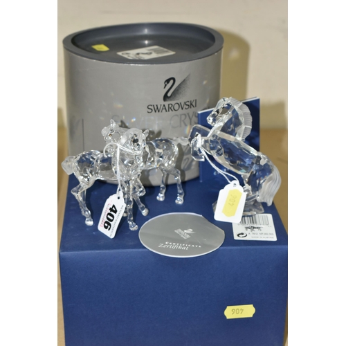 406 - TWO BOXED SWAROVSKI CRYSTAL SCULPTURES OF HORSES, comprising a Foals Clear figure group no 627637, f... 