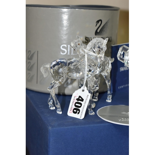 406 - TWO BOXED SWAROVSKI CRYSTAL SCULPTURES OF HORSES, comprising a Foals Clear figure group no 627637, f... 