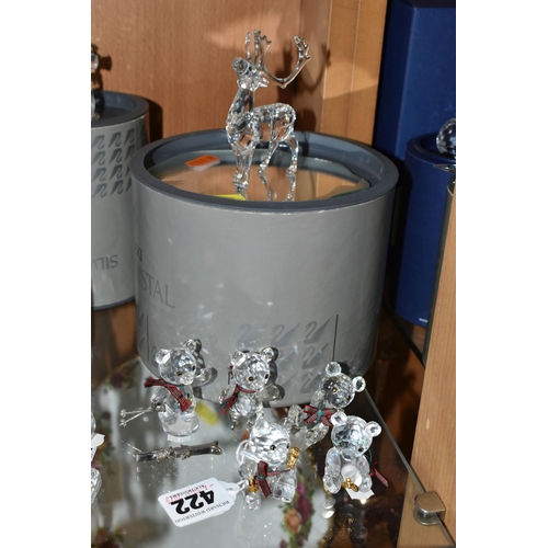 422 - A BOXED SWAROVSKI CRYSTAL REINDEER AND FIVE BOXED SWAROVSKI 'KRIS BEARS', comprising Reindeer no 214... 