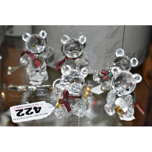 422 - A BOXED SWAROVSKI CRYSTAL REINDEER AND FIVE BOXED SWAROVSKI 'KRIS BEARS', comprising Reindeer no 214... 