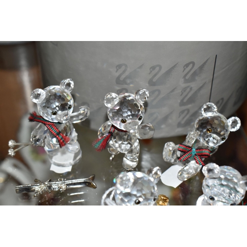 422 - A BOXED SWAROVSKI CRYSTAL REINDEER AND FIVE BOXED SWAROVSKI 'KRIS BEARS', comprising Reindeer no 214... 