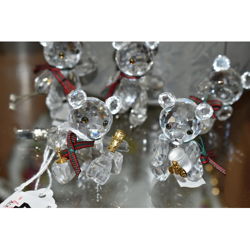 422 - A BOXED SWAROVSKI CRYSTAL REINDEER AND FIVE BOXED SWAROVSKI 'KRIS BEARS', comprising Reindeer no 214... 