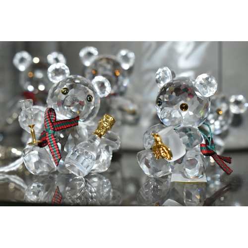 422 - A BOXED SWAROVSKI CRYSTAL REINDEER AND FIVE BOXED SWAROVSKI 'KRIS BEARS', comprising Reindeer no 214... 