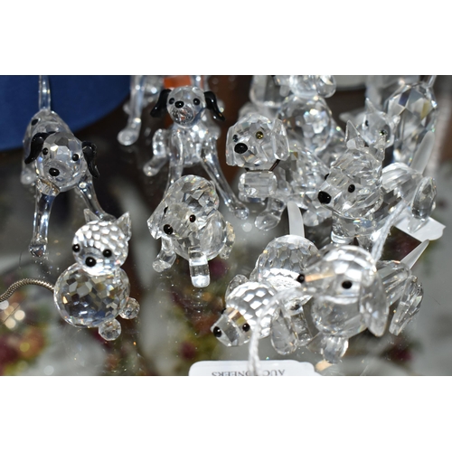 423 - A GROUP OF SWAROVSKI CRYSTAL 'A PETS CORNER' SERIES AND SIMILAR SCULPTURES, comprising a boxed Stand... 