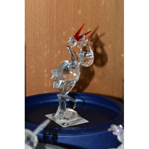 424 - A GROUP OF SWAROVSKI CRYSTAL SCULPTURES, comprising a boxed Stork with Baby in a Basket no 659401 fr... 