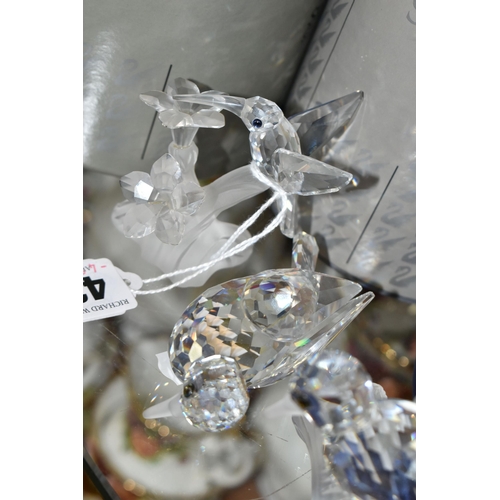 424 - A GROUP OF SWAROVSKI CRYSTAL SCULPTURES, comprising a boxed Stork with Baby in a Basket no 659401 fr... 