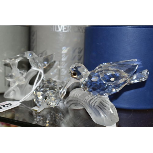 424 - A GROUP OF SWAROVSKI CRYSTAL SCULPTURES, comprising a boxed Stork with Baby in a Basket no 659401 fr... 