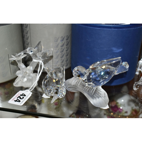 424 - A GROUP OF SWAROVSKI CRYSTAL SCULPTURES, comprising a boxed Stork with Baby in a Basket no 659401 fr... 