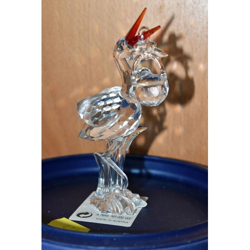 424 - A GROUP OF SWAROVSKI CRYSTAL SCULPTURES, comprising a boxed Stork with Baby in a Basket no 659401 fr... 