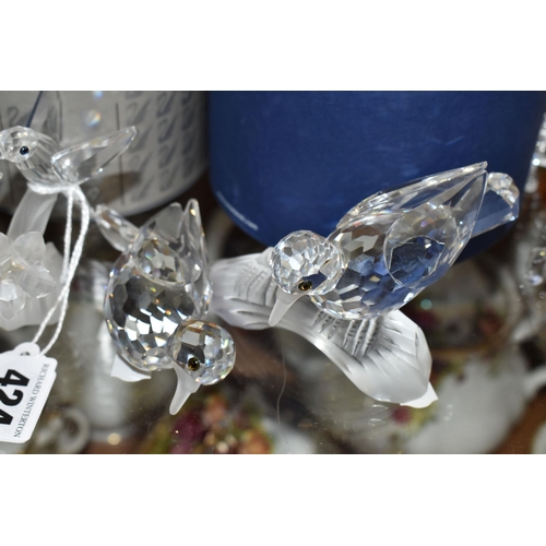 424 - A GROUP OF SWAROVSKI CRYSTAL SCULPTURES, comprising a boxed Stork with Baby in a Basket no 659401 fr... 