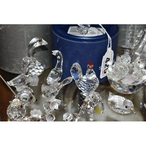 425 - A COLLECTION OF SWAROVSKI CRYSTAL ANIMAL AND BIRD FIGURES, from series including Barnyard Friends, B... 