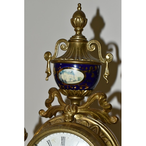 326 - A MODERN ITALIAN 'IMPERIAL' BRASS AND PORCELAIN CLOCK GARNITURE, the finials, columns and front all ... 