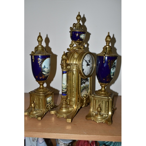 326 - A MODERN ITALIAN 'IMPERIAL' BRASS AND PORCELAIN CLOCK GARNITURE, the finials, columns and front all ... 