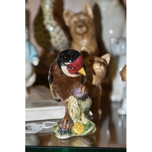 331 - A COLLECTION OF CERAMIC ANIMAL FIGURES, to include a Beswick Peter Rabbit 'Peter on His Book' P4217,... 