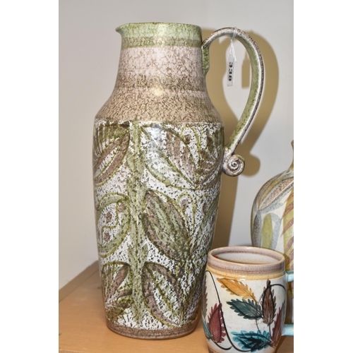 338 - THREE PIECES OF DENBY CERAMICS BY GLYN COLLEDGE, comprising a green and brown jug, height 34cm, a bu... 