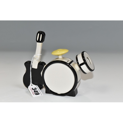 349 - A LORNA BAILEY 'THE BEATLES STORY' SMALL TEA POT IN THE FORMOF A DRUM KIT AND GUITAR, signed to the ... 