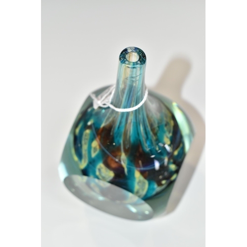 352 - A MDINA GLASS FACET CUT CUBE VASE, the slender conical neck over a cube with four circular facets, t... 